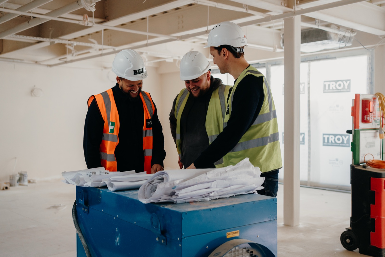 A Re:shape project team reviewing plans on site